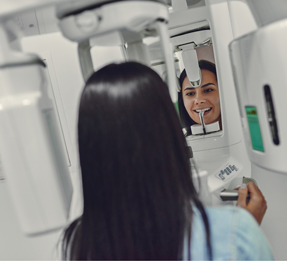 Dental patient getting a CT cone beam scan of her mouth