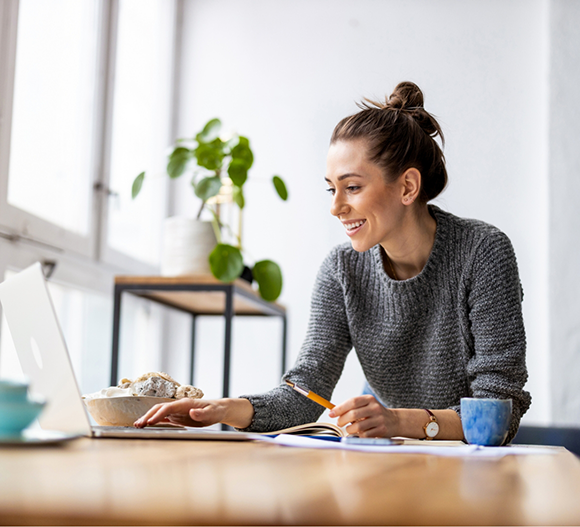 Woman using a laptop at home