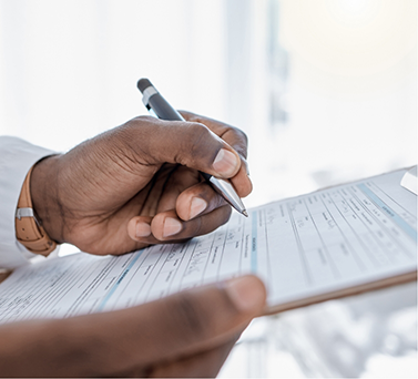 Person filling out paperwork