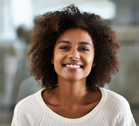 Smiling woman in a white sweater