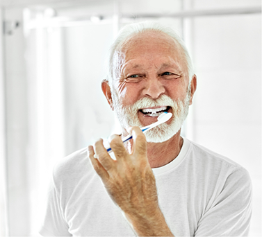 Senior man brushing his teeth