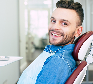 Young man smiling in the dental chair