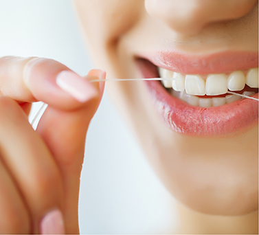 Person flossing their teeth