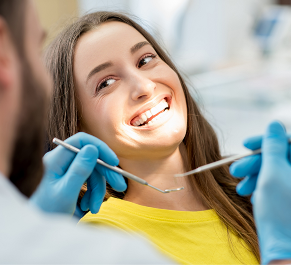 Woman grinning at her dentist