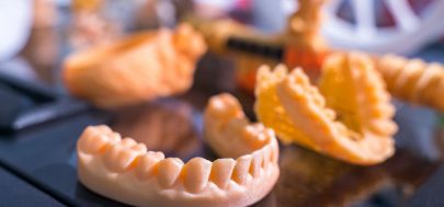 Several 3D printed models of teeth