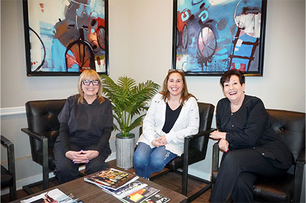 Three smiling dental team members at Sean Brown, DDS