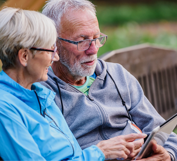 Senior couple looking at a tablet