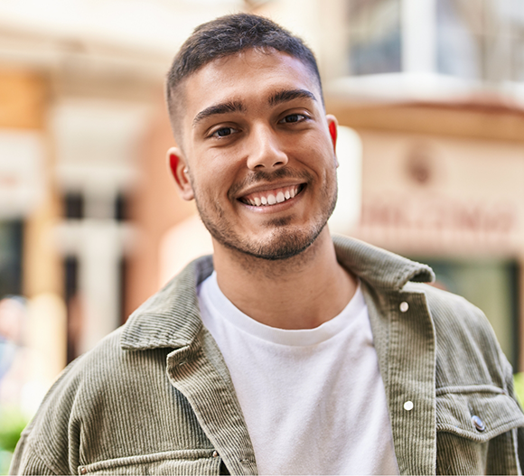 Young man smiling outdoors