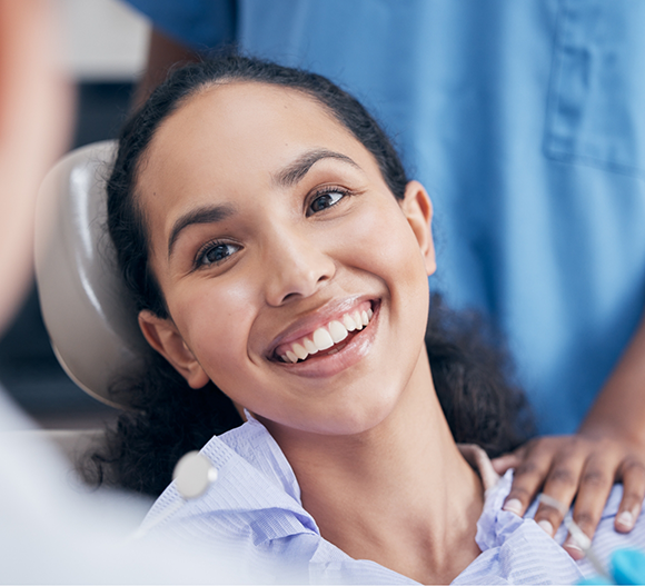 Woman smiling at her dentist