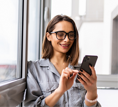 Smiling woman looking at her phone