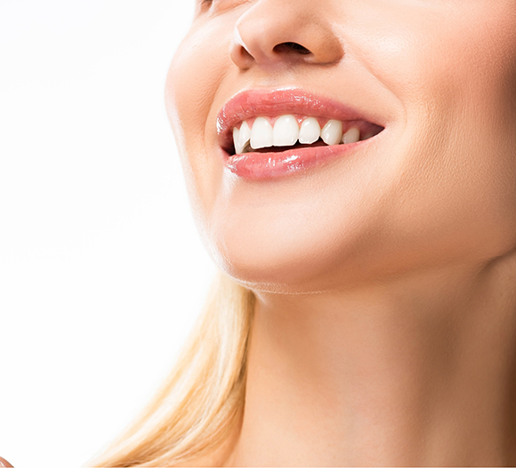 Close up of a blonde woman with a flawless smile