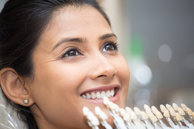 Woman getting veneers placed.