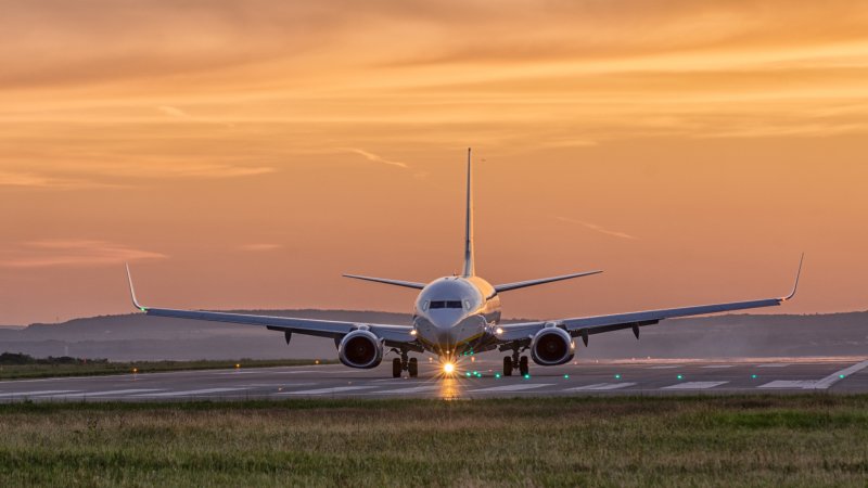 Airplane taxis on runway.
