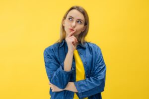 Woman striking a pose with skeptical look.